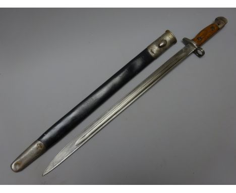 WWl Bayonet with 43cm single edge fullered blade, ricasso stamped Crowned GR over 1907, Wilkinson, Crows foot, G over E, wood