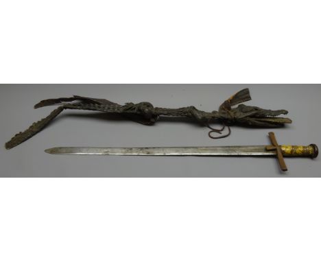 Sudanese Kaskara Sword, 74cm broad double edged part fullered blade engraved with opposing moons, crocodile skin bound wooden