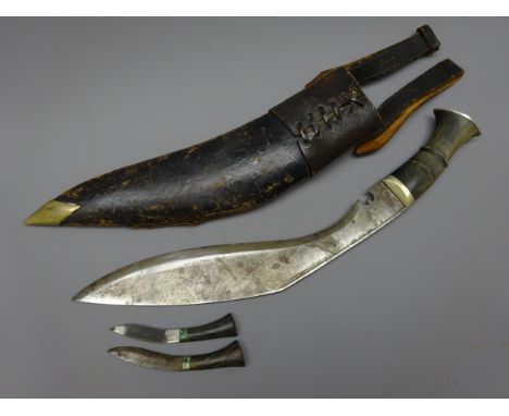 Gurkha Kukri knife, 31cm shaped steel blade with horn handle, in steel tipped black leather scabbard with two smaller knives 