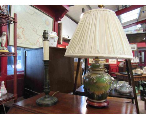 An Asian foliate design table lamp on wooden base and a brass candlestick form table lamp