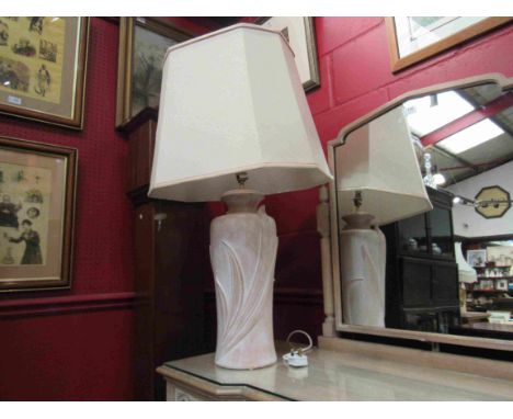 A terracotta Art Nouveau style urn shaped table lamp base with cream shade 
