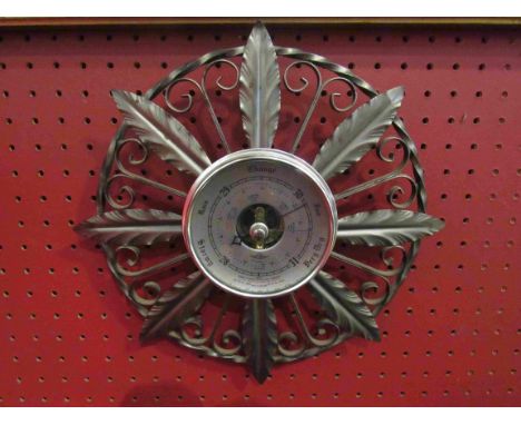 A Shortland barometer with acanthus leaf detail and scroll frame and a brass bed warming pan