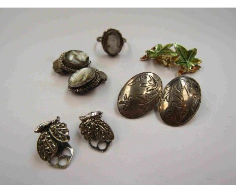A mother-of-pearl cameo ring and earring set and associated earrings
