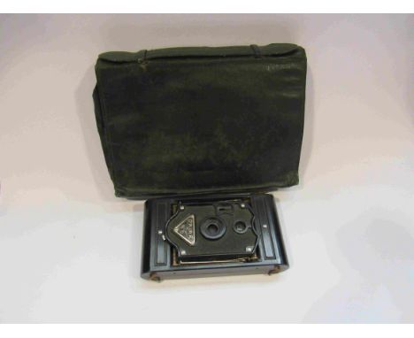 A leather clutch bag and a Rajar camera