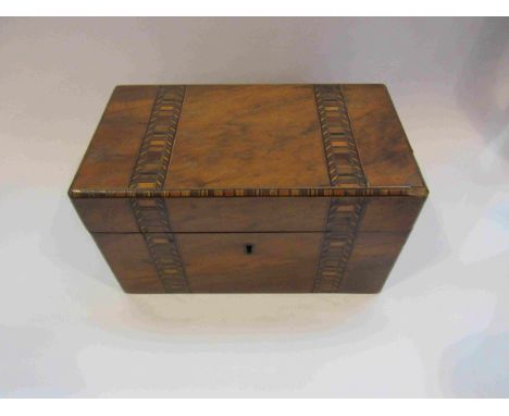 An inlaid tea caddy with lidded interior