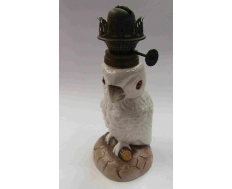 A Victorian porcelain parrot oil lamp, 22cm tall