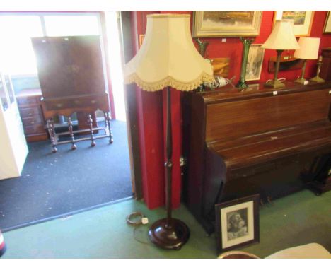 An early 20th Century mahogany standard lamp with shade