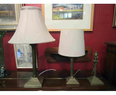 A brass column form lamp base and two others (3)