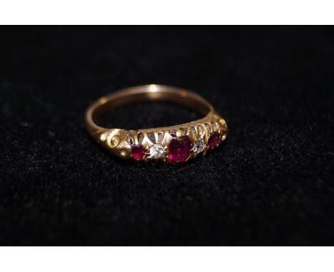 18 carat gold ring set with rubies and diamonds, size K  