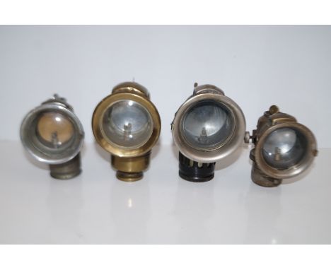 Group of four vintage carbide lamps comprising "The Revenge" by P &amp; H Ltd, "British Miller Made" and two Lucas Calcia Cad