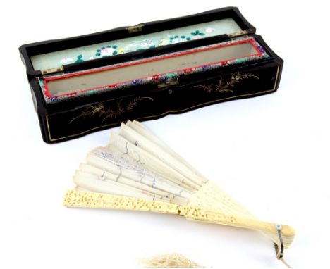 19th century Chinese carved ivory fan decorated with figures in a landscape, embroidered with a dragon, in fitted case and bl