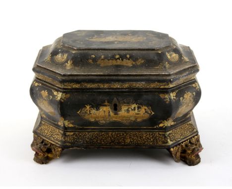 Chinese black lacquered and gilt decorated tea caddy with two pewter compartments and covers, on shaped dragons head bracket 