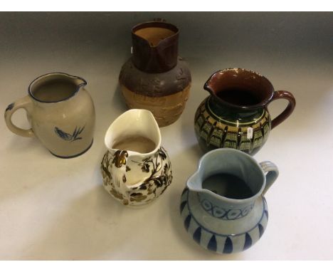 A set of ceramic jugs to include blue Buchan piece and Mason's Oak piece with gilt flowers etc.