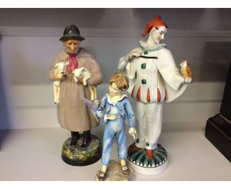 A Royal Doulton figurine of an old shepherd with two lambs, a Royal Worcester figurine of a boy with a bird, and a clown figu