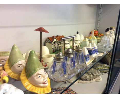 A selection of ceramic and glass salt and pepper cellars in various different designs and styles.