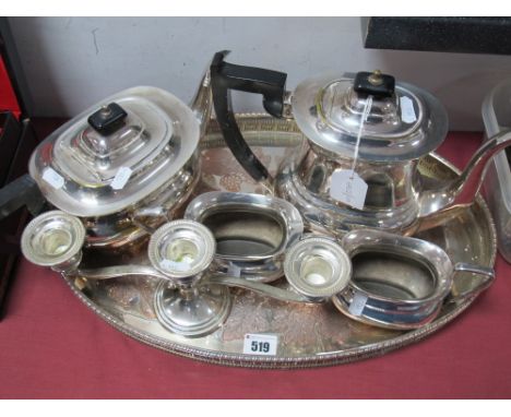 A Plated Four Piece Teaset, together with an oval plated tray and a dwarf twin branch candlestick. 