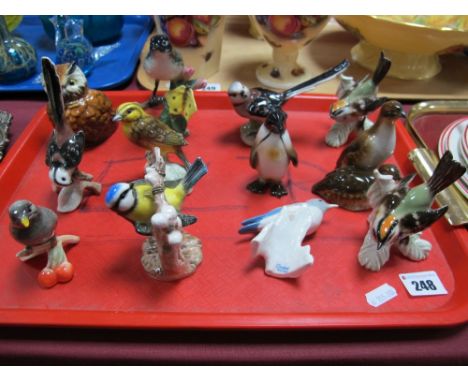 Goebel- Twelve glazed matt pottery birds to include blue titmouse, yellow hammer, penguin. 
