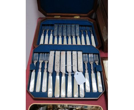A Wooden Cased Set of Twelve Mother of Pearl Handled Dessert Knives and Forks. 