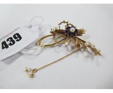 A 9ct Gold Pearl Set Brooch, of floral spray openwork design, claw set to the centre. 