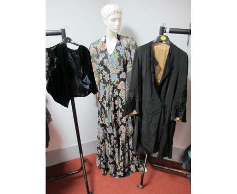 A c.1920's Black Opera Coat, fastened asymmetrically with a single button at the hip, the lower body and sleeve with zig-zag 