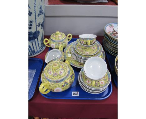 Oriental Chinese Pottery Tea Service, of twenty pieces with multicoloured floral decoration on yellow ground.