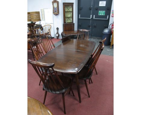 Ercol Set of Six Comb Back Dining Chairs, together with table, on splayed legs, 152cm wide.