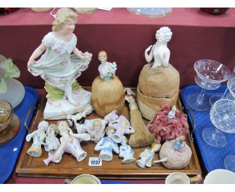 Two Pin Cushion Dolls, with various other loose ceramic pincushion dolls bodies and a bisque figurine of a child 30cm high:- 