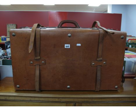 A Vintage Brown Leather Suitcase, with 'Vuen Chong' stamped to one buckle, with J.G.B, initialed to front, 76 x 43 x 24cm and