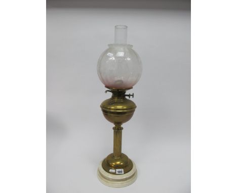 A Victorian Oil Lamp, with pink tinted shade and white pot base by J. Shaw of Walsall.