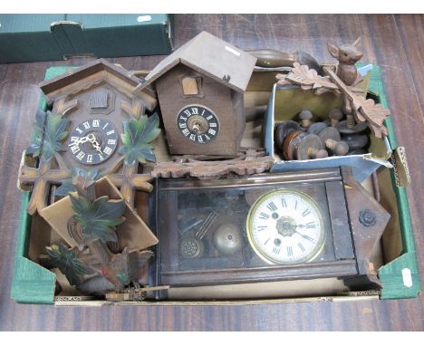 Two Wooden Cuckoo Clocks, with weights and carved wooden decoration, with one other clock, and box of loose knobs:- One Box.