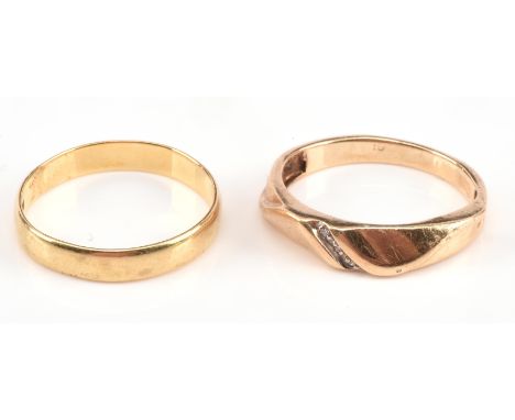 Two gold rings, one wedding band stamped 18 ct, ring size R and a diamond set band, testing as 9 ct, ring size PCondition Rep