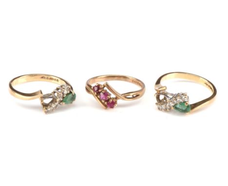 Three vintage gem set rings, including two matching emerald and diamond ring, set with round cut diamonds and a pear cut emer