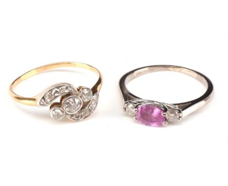 Modern pink sapphire and diamond ring, oval cut pink sapphire weighing an estimated 0.55 carat, with a diamond each side weig