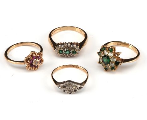 Four vintage rings, including a ruby and diamond daisy ring, size K 1/2, a diamond and synthetic emerald cluster ring, size L
