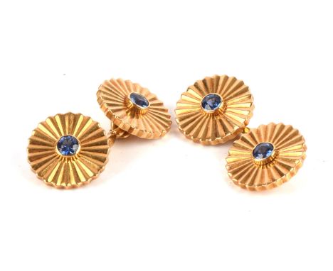 Cartier cufflinks, set with round cut blue sapphires within grooved surrounds, with polished spacers, signed Cartier, numbere