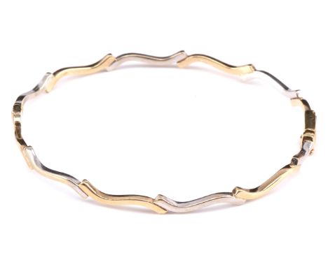 Bi coloured wave bangle, 65mm internal diameter, with concealed clasp and safety clip, stamped 9 ct Condition Report:  gross 