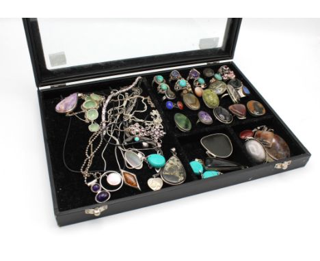 Display case of costume jewellery necklaces and twenty six gemstone rings, an oval cabochon cut labradorite ring size R, a la
