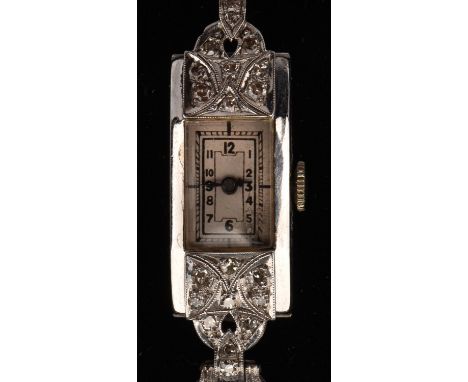 Diamond cocktail watch, rectangular dial with Arabic numerals, with single cut diamonds set to the lugs, on a black woven bra