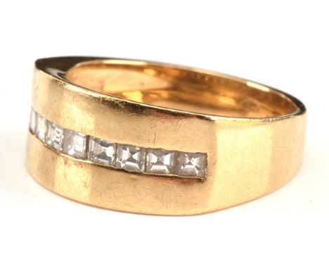 Diamond half hoop ring, set with nine square step cut diamonds, estimated total diamond weight 0.72 carat, in a thick band ch