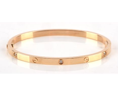 Cartier small diamond Love Bangle is 18 ct yellow gold, set with six round brilliant cut diamonds, together with box, screwdr