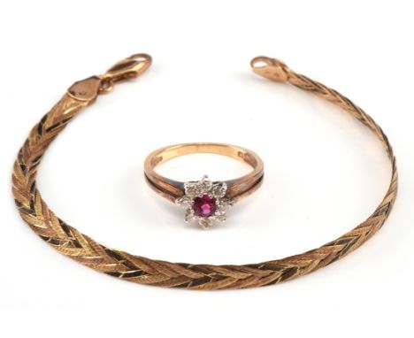 Ruby and diamond daisy cluster ring, with a central round cut ruby weighing an estimated 0.20 carat, surrounded by eight roun