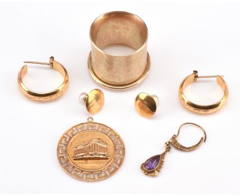 A group of items, including a wide band ring in mat hammered finish with loose ring encircling it, size T, tested as 9  ct, a