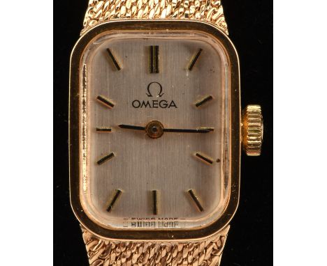 Omega a  Ladies gold wrist watch the silvered signed dial with baton hour markers, fitted with a calibre 485 manual wind move