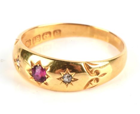 Ruby and diamond gypsy set ring, set with a central round cut ruby and two accent diamonds, hallmarked 18 ct yellow gold date