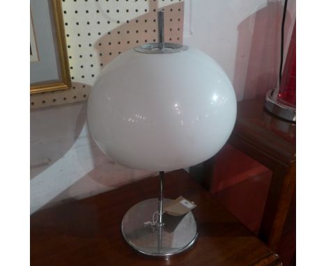 An Italian 1970's table lamp with opaque shade on chromed supports 