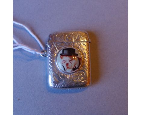 A hallmarked silver vesta case with enamel inset depicting dog portrait 