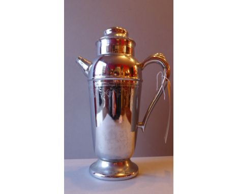 A large silver plated wine decanter with scroll handles and funnell spout