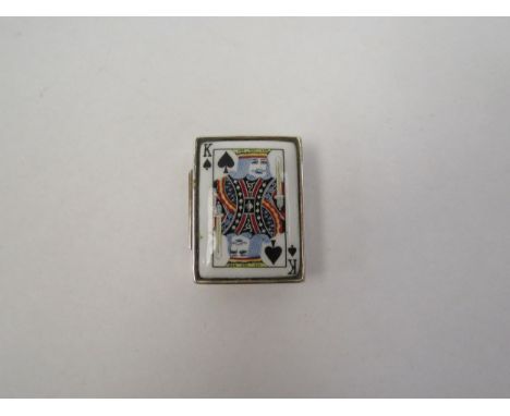 A modern silver and enamel pill box decorated with playing card 