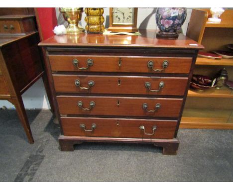 A George III mahogany chest of four long drawers, brass swan neck handles, bracket feet, some losses, 77cm high x 84cm wide x