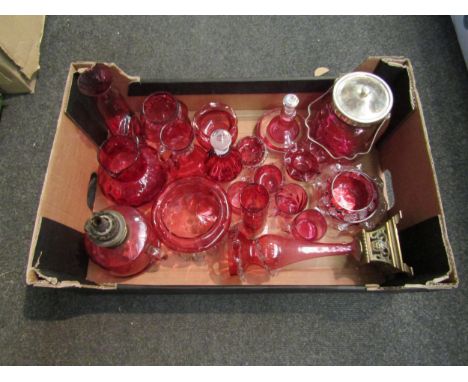 A large selection of ruby and cranberry glassware including a Dartington scent bottle, oil lamp etc 